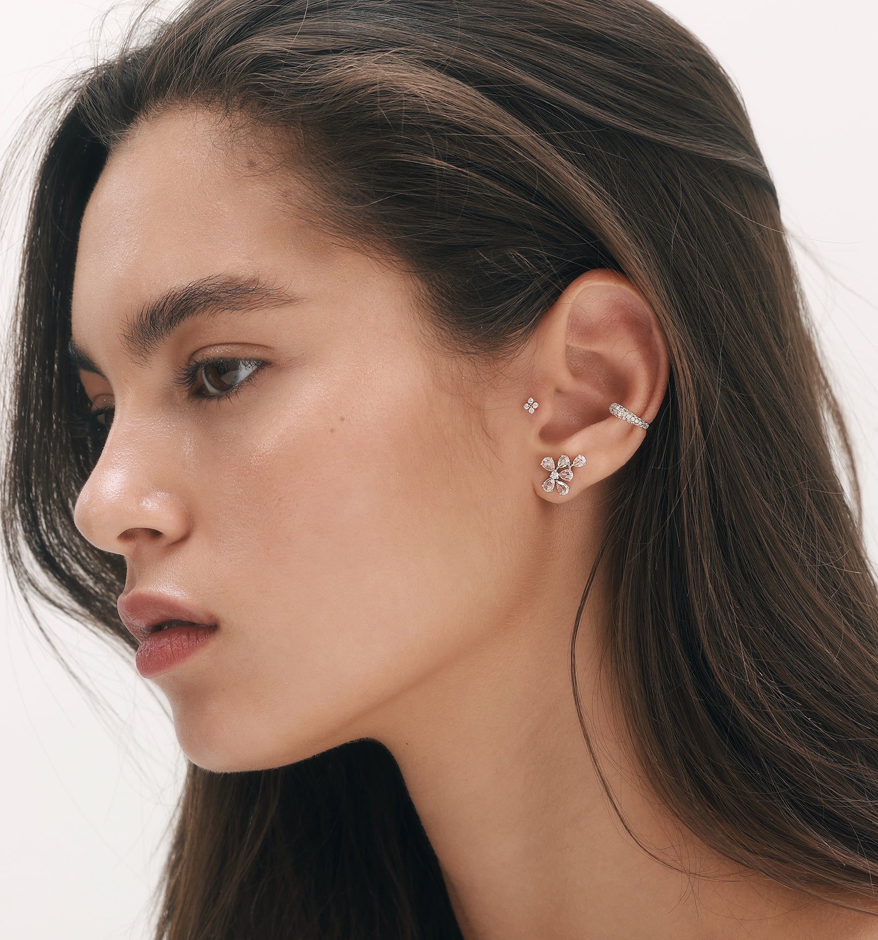 BIANCA diamond earring styled in curated ear composition with diamond earrings on model
