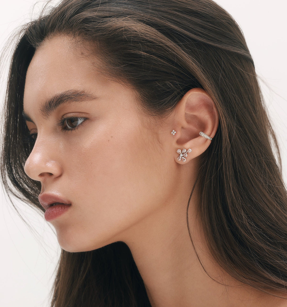 BIANCA diamond earring styled in curated ear composition with diamond earrings on model