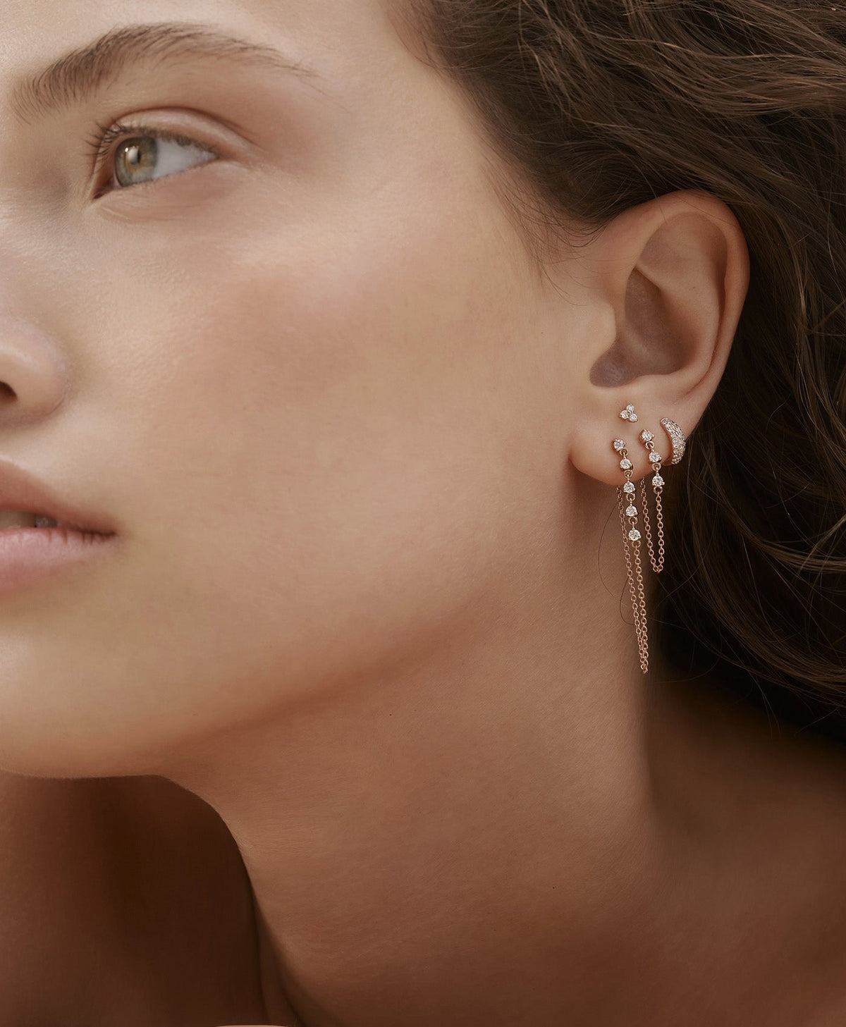 HOOK No. 2 diamond drop earring in rose gold styled with MINI PUFFE diamond huggie hoop earring in curated ear composition on model