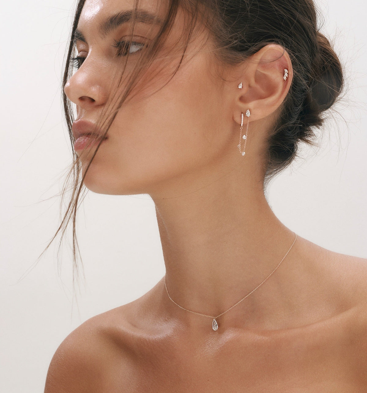 PEAR shape floating lab diamond necklace in yellow gold worn on model