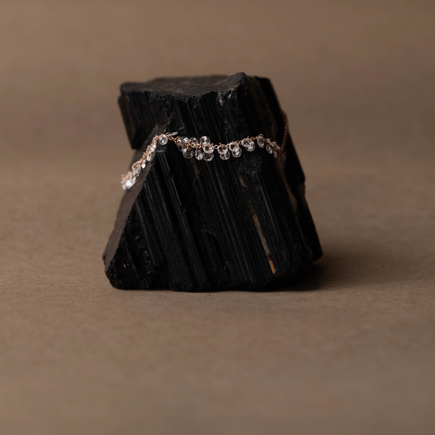Fusion collection rose gold floating diamonds bracelet set with natural diamonds on a black natural stone composition